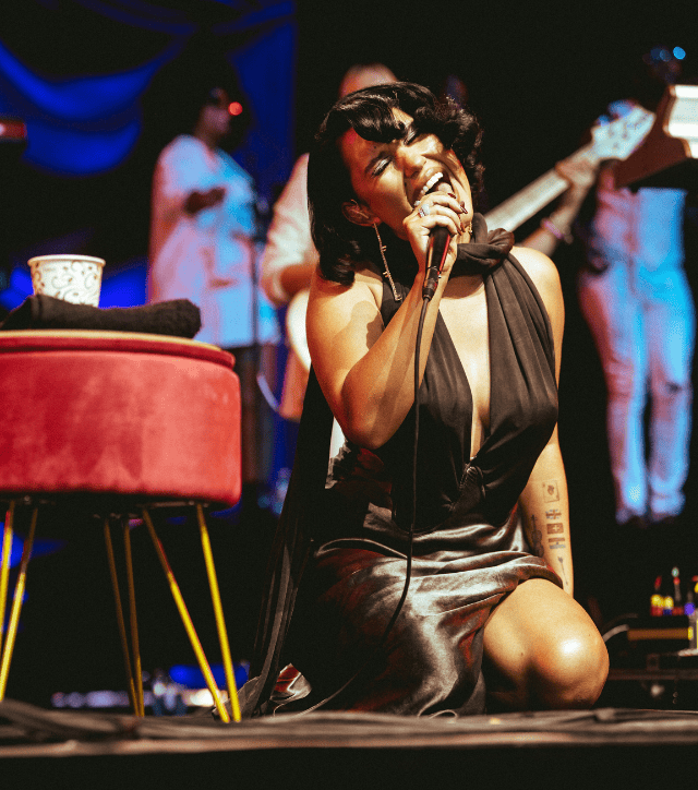 Raye performing